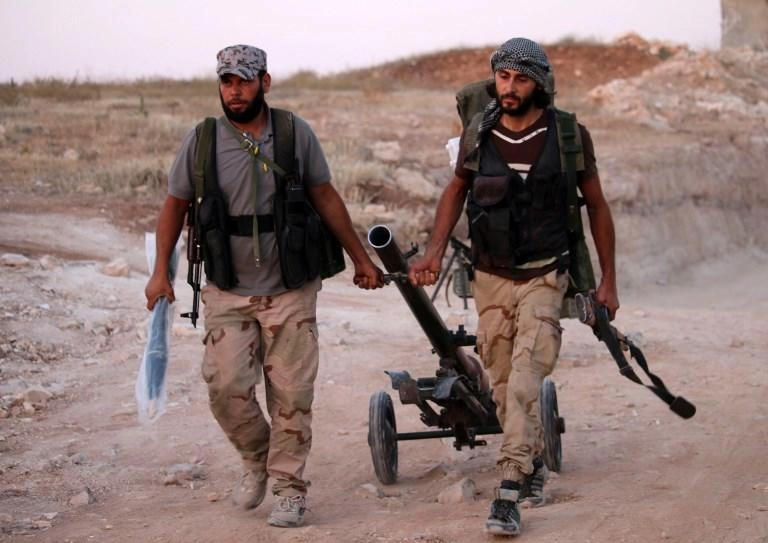 بدء عملية إجلاء مقاتلي الفصائل المعارضة من مدينة درعا